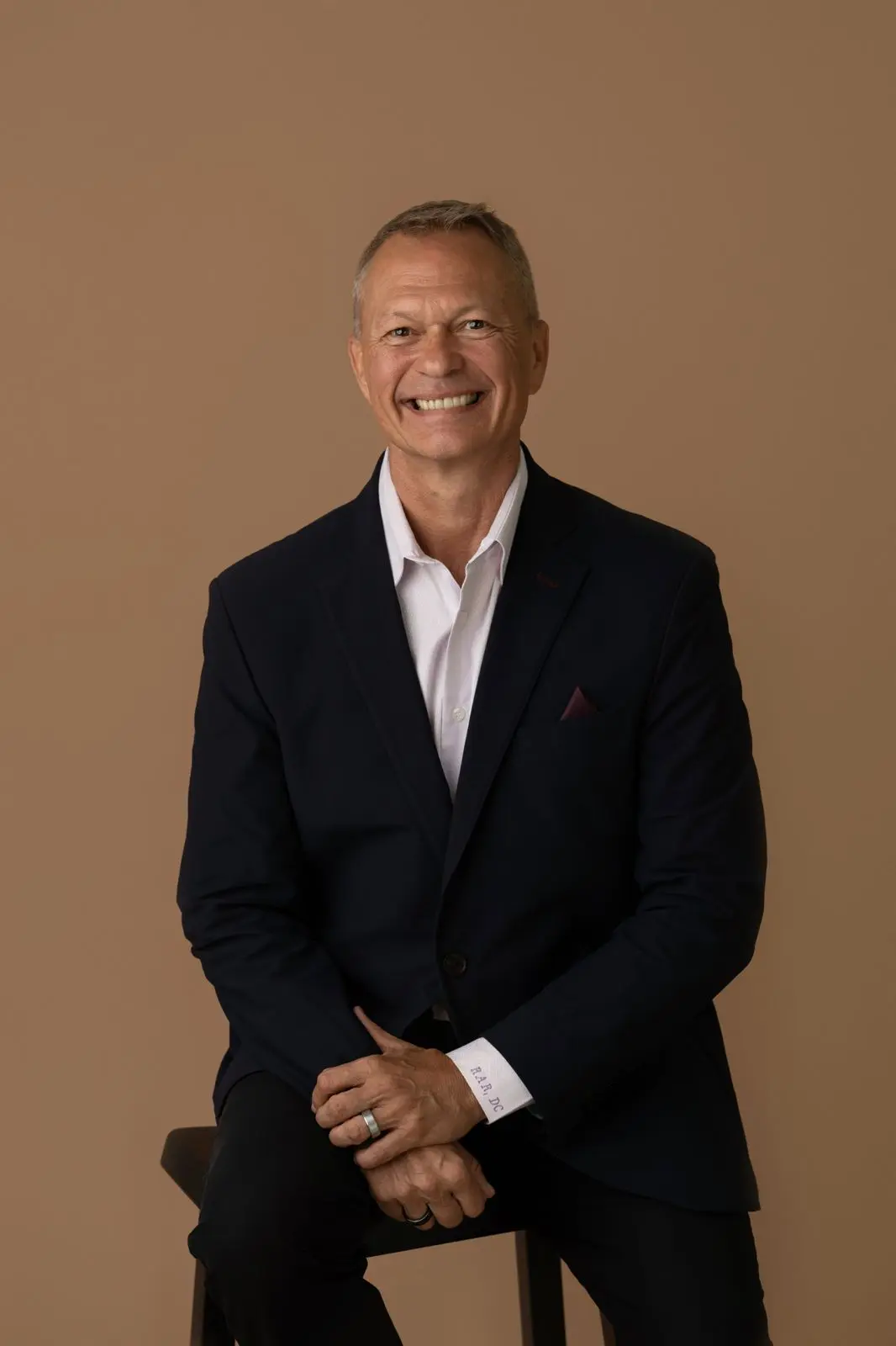 Dr. Bob Rakowski seated in his Houston clinic